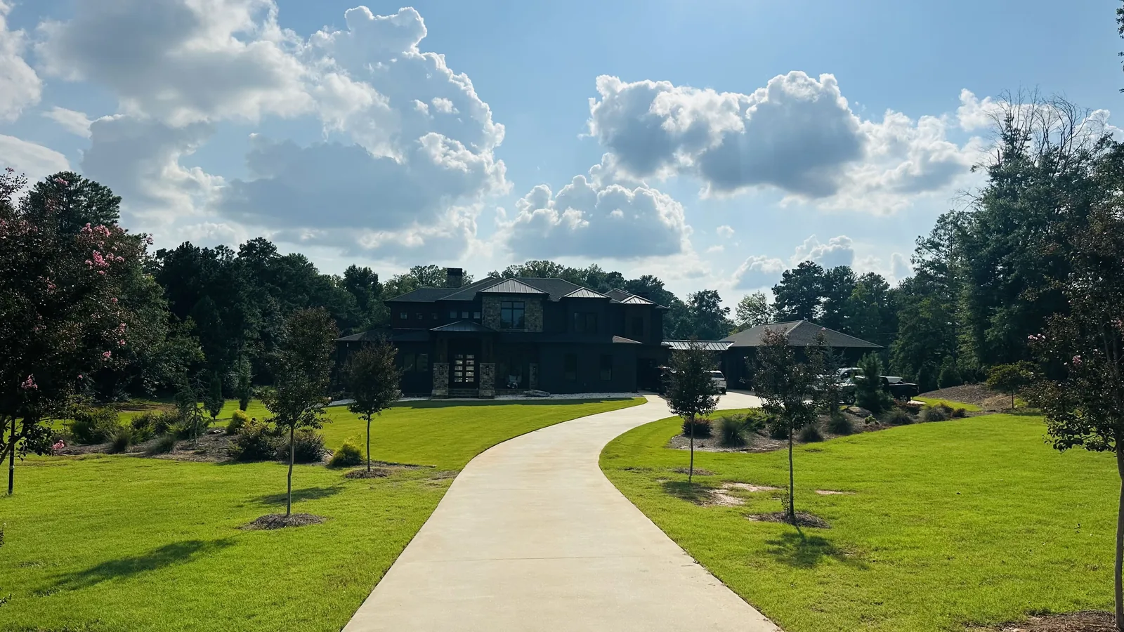 Concrete drive leading up to the barn and main house at Horse Boarding Georgia